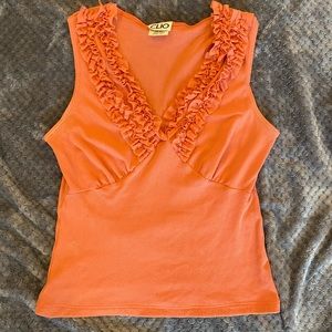 Adorable GC ruffleneck sleeveless top in a coral orange